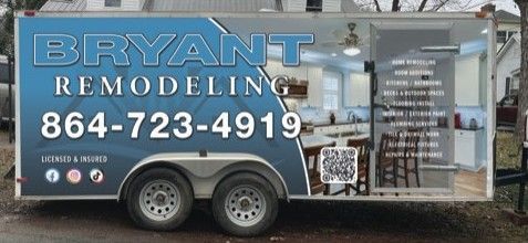 Bryant Remodeling trailer with blue logo, phone number, and service list parked outdoors