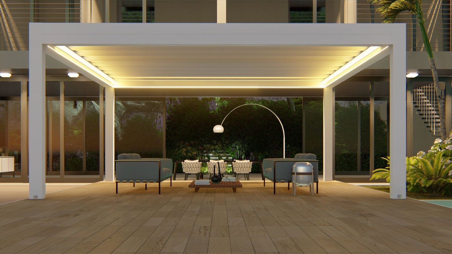 Patio moderno con sedute imbottite sotto un pergolato illuminato di notte.
