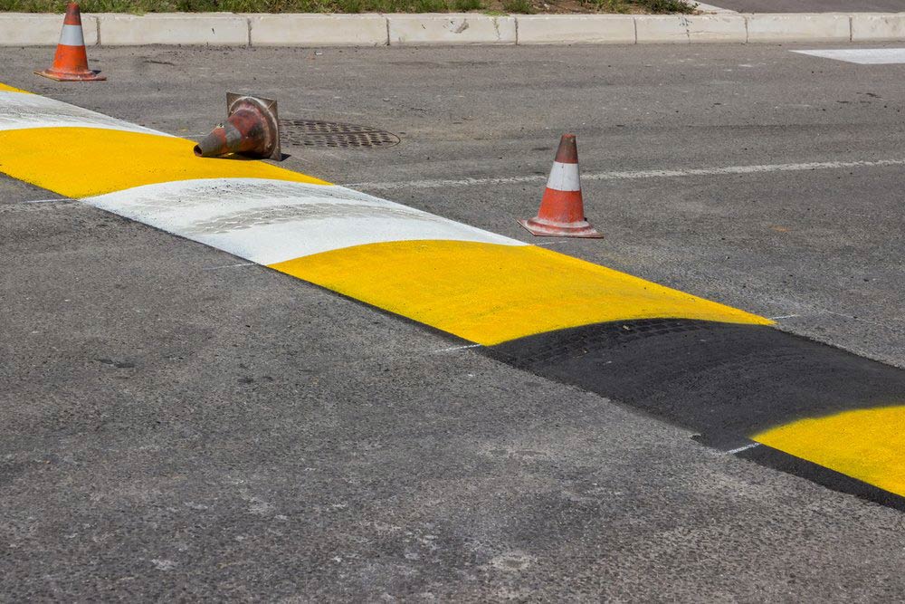 Freshly Painted Speed Hump — Bitumen Services in Darwin, NT
