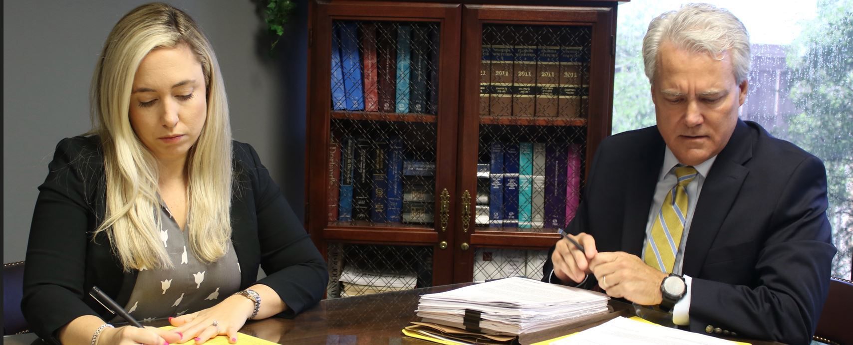 Attorney Looking At The Paper — Tallahassee, FL — Pennington P.A. Attorney Looking At The Paper — Tallahassee, FL — Pennington P.A.
