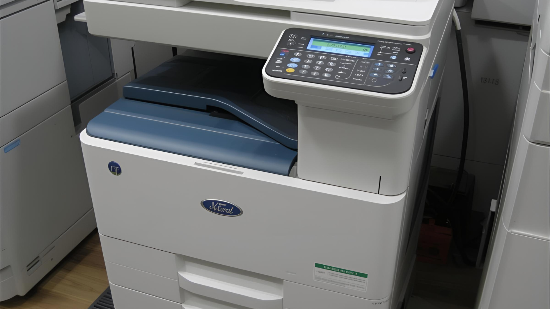 A large, light-gray Xerox multifunction printer with a blue top and control panel.