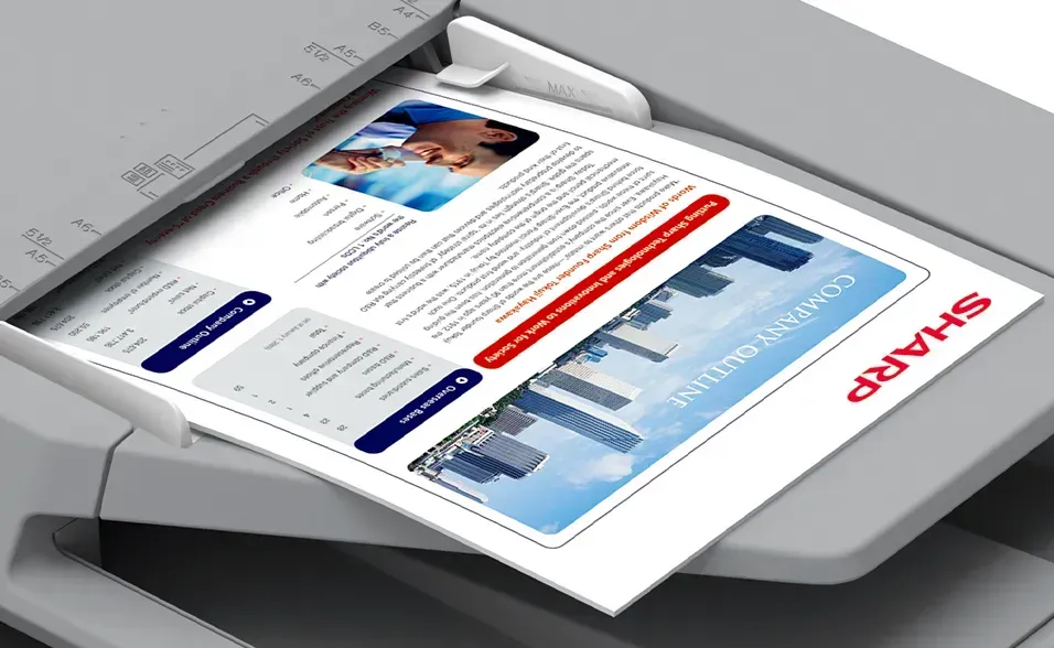 A document being scanned on a Sharp copier, showcasing a colorful business report.
