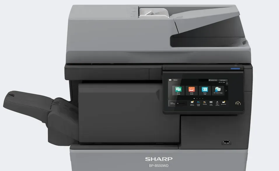 A gray and black Sharp multifunction printer with a touchscreen interface and an open output tray.