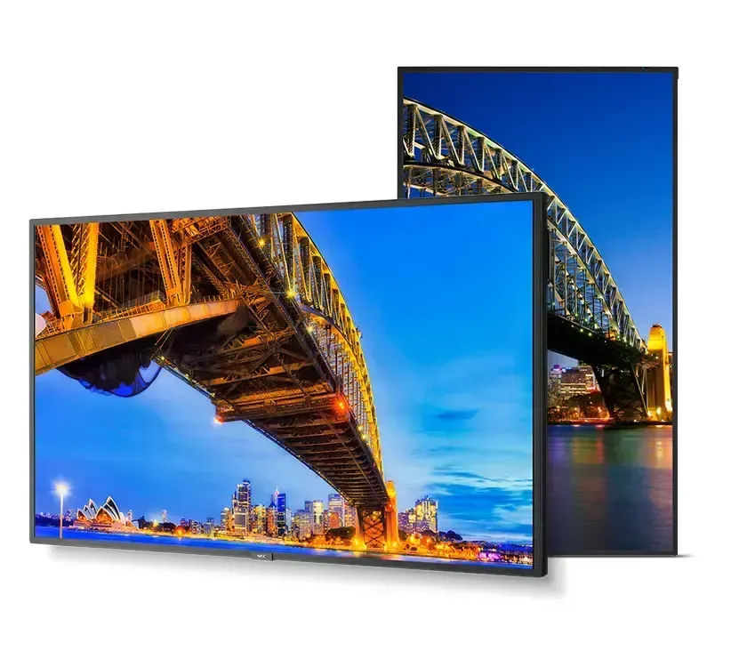 Two framed photos of a lit bridge at dusk, one horizontal and one vertical