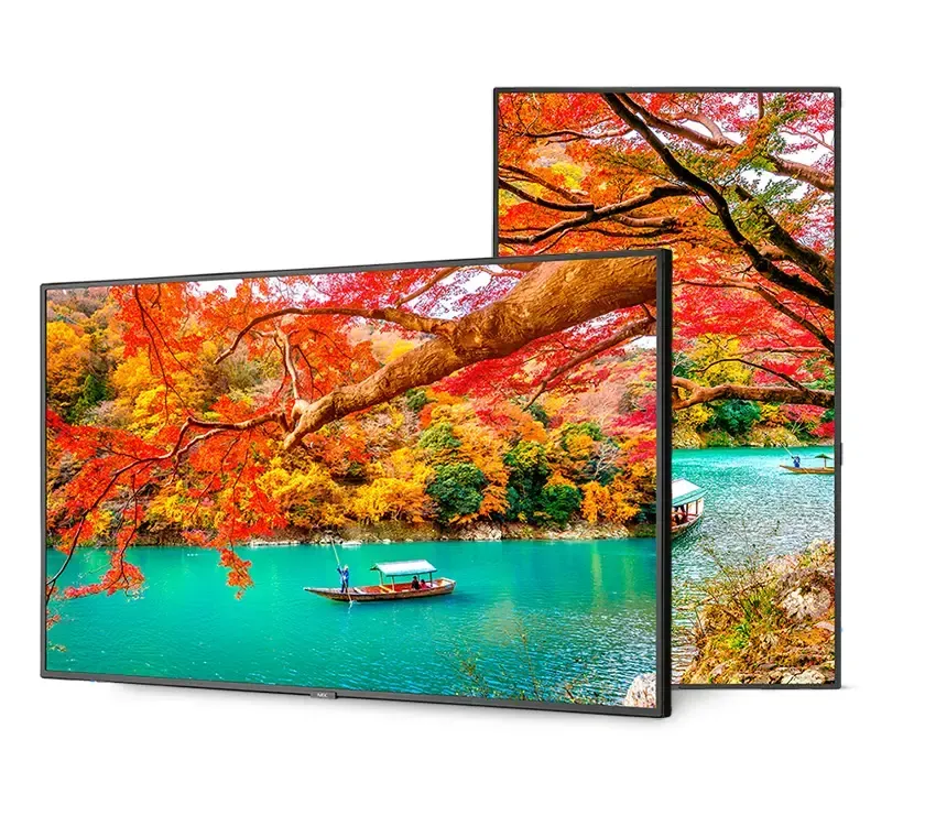 Two flat-screen TVs displaying a colorful autumn landscape with water and a boat.