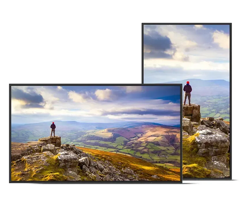 Two digital displays show a person standing on a mountain peak, landscape view.