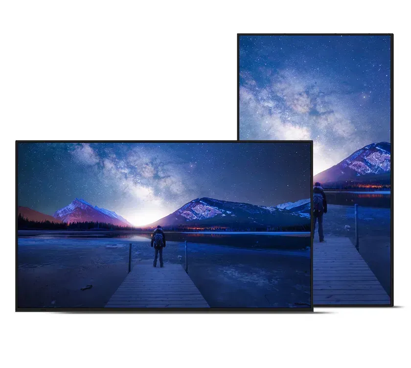 Two rectangular screens showing a night scene with a person on a dock, mountains, and starry sky.