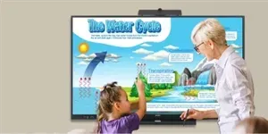 A teacher and a child point at a diagram of the water cycle on a large screen in a classroom.