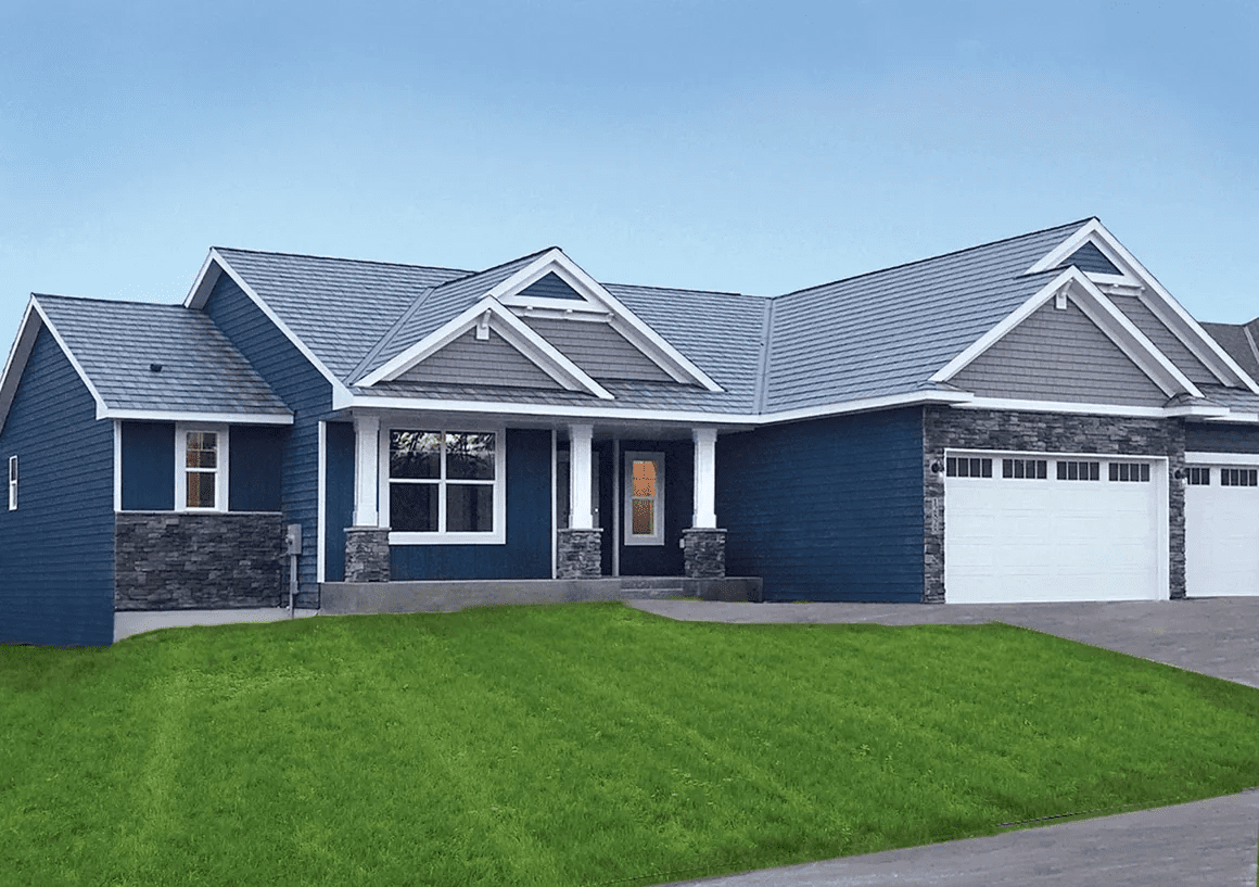 Modern blue-gray suburban house with a large green lawn and two-car garage