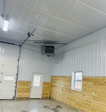 A garage with wooden walls and a white door.