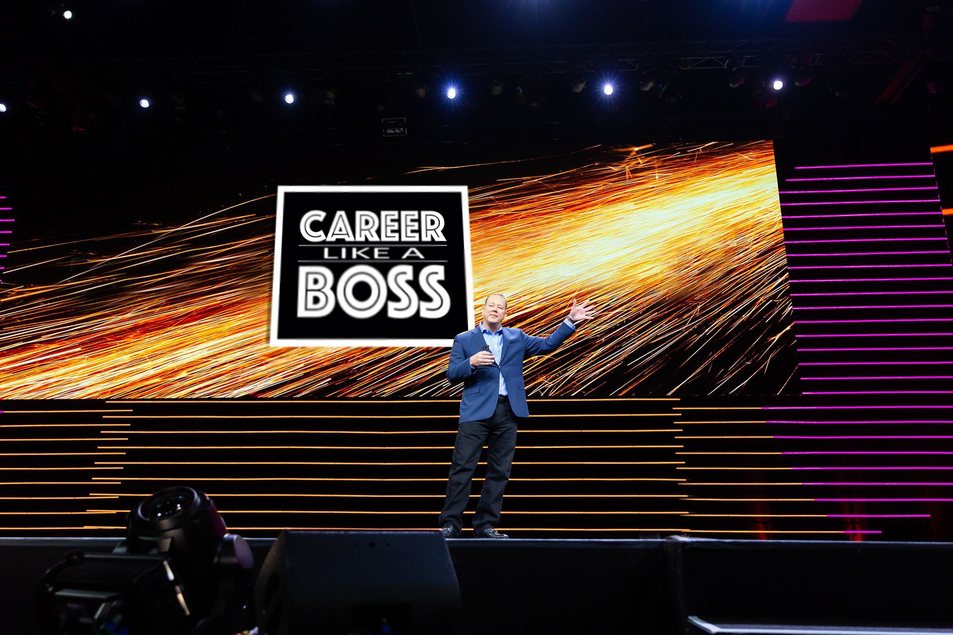 A man giving a speech is standing on a stage with a sign that says career like a boss