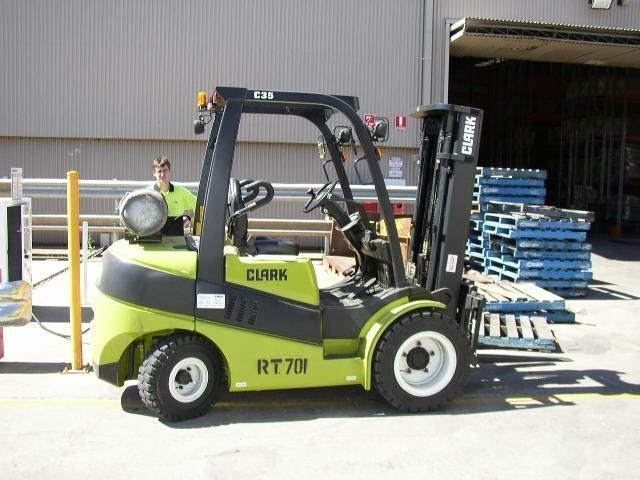 A Yellow Forklift Is Carrying a Load of Boxes in a Warehouse | Shepperton, VIC | L&P Mackin Forklifts