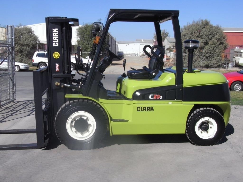 Two Forklifts Are Parked Next to Each Other in a Gravel Lot | Shepperton, VIC | L&P Mackin Forklifts