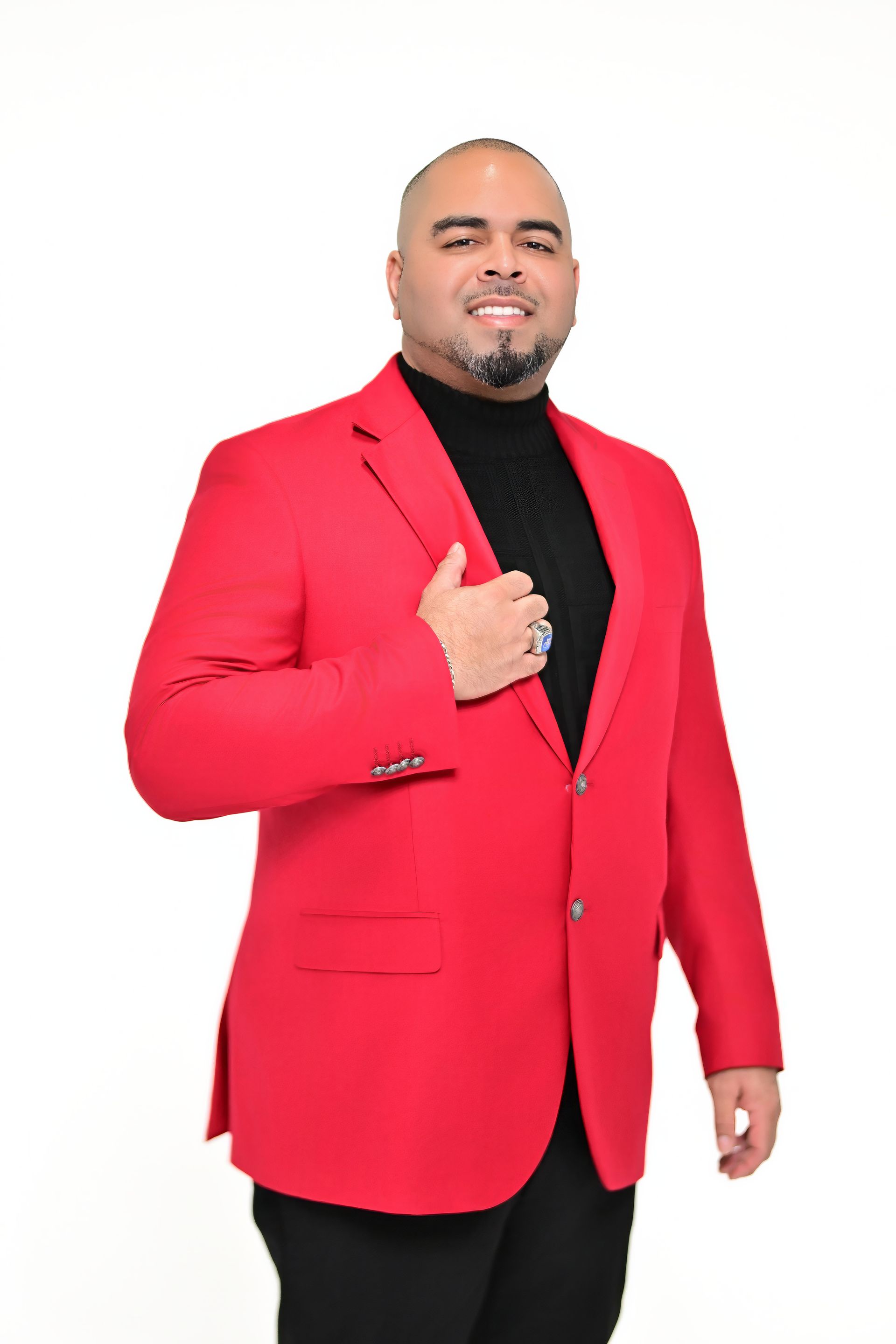 A man in a suit and tie is smiling for the camera.