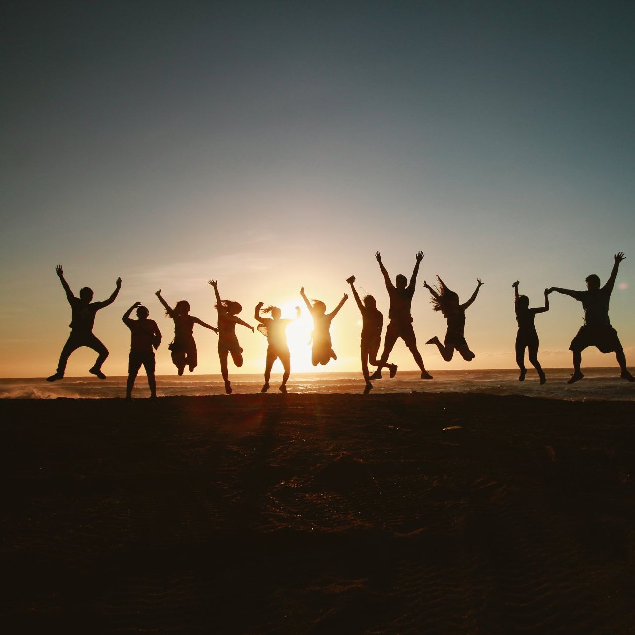Group of people dancing in the sunlight