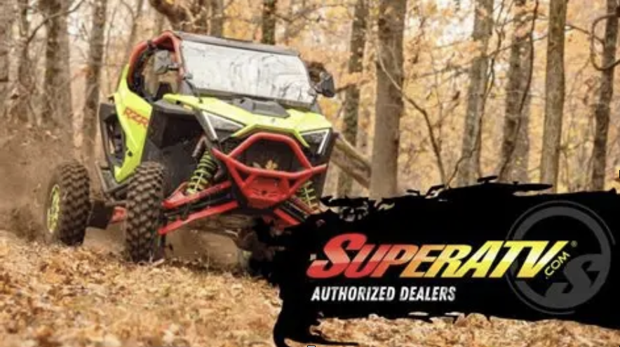 Lime green side-by-side UTV driving through a wooded area with red accents. SuperATV logo in the foreground.