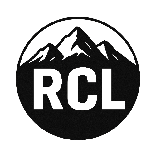 Black-and-white circular RCL logo with mountain peaks above bold letters