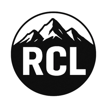 Black-and-white circular RCL logo with mountain peaks above bold letters