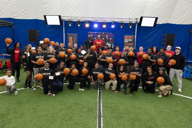 Drone Basketball teams and coaches posing together