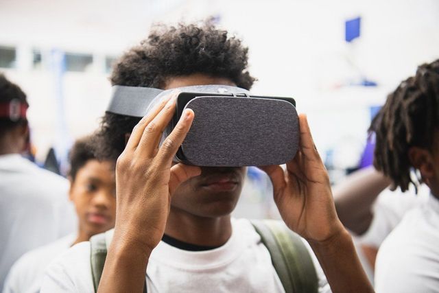 A scholar wearing a VR headset