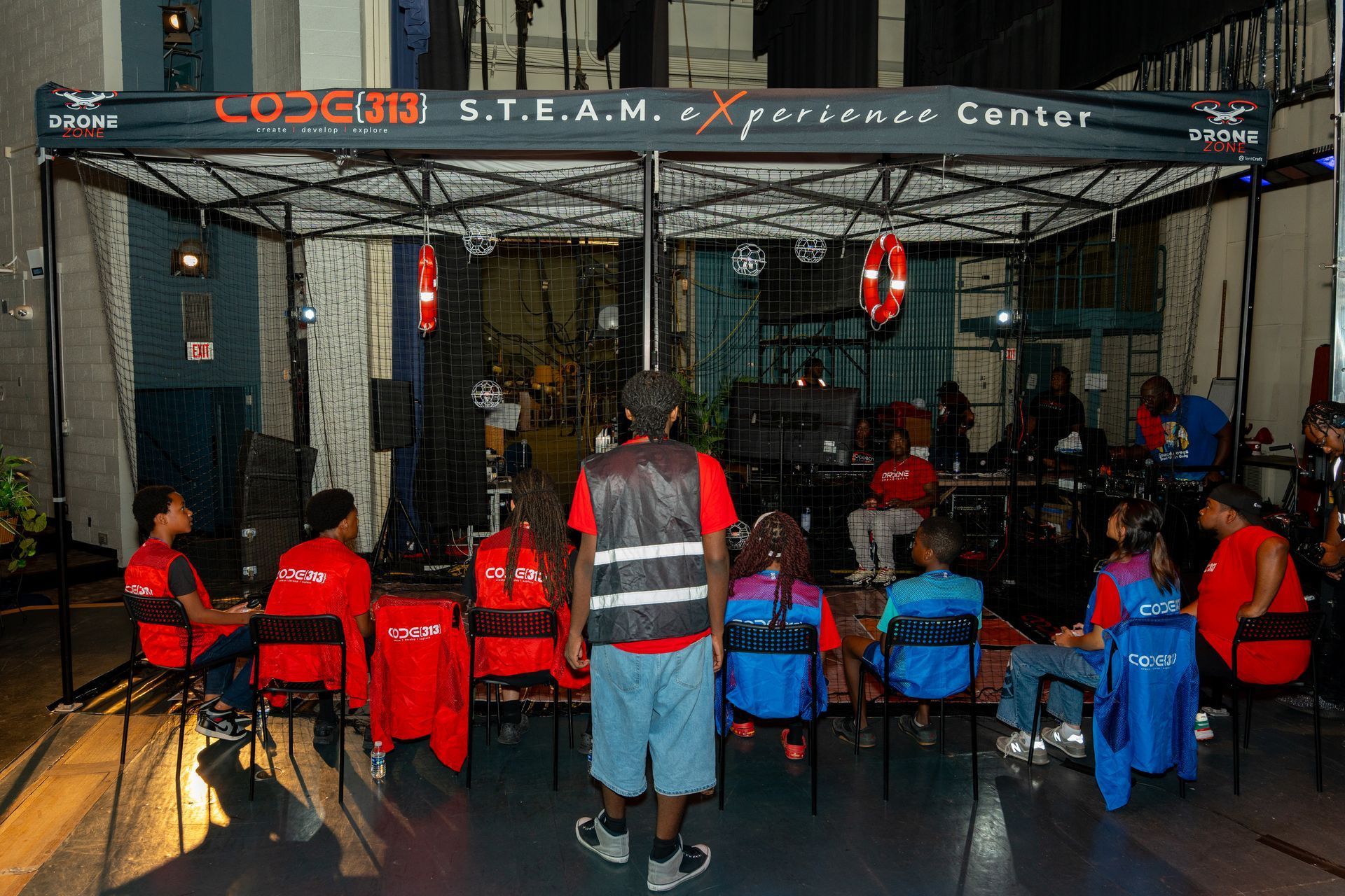 The CODE313 STEAM eXperience tent at an outdoor event