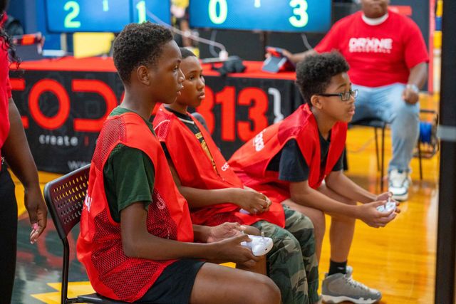 Scholars piloting drones with controllers