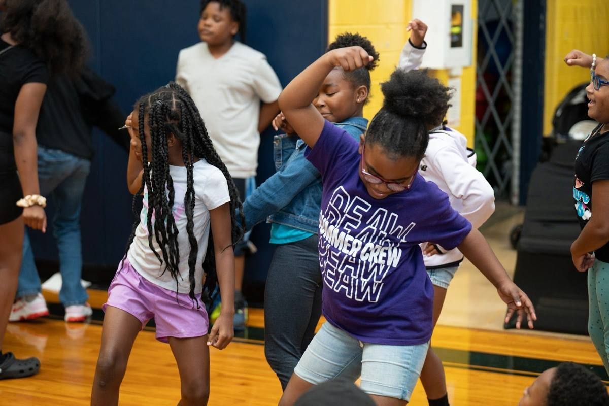 Scholars celebrating at a CODE313 Drone Basketball tournament