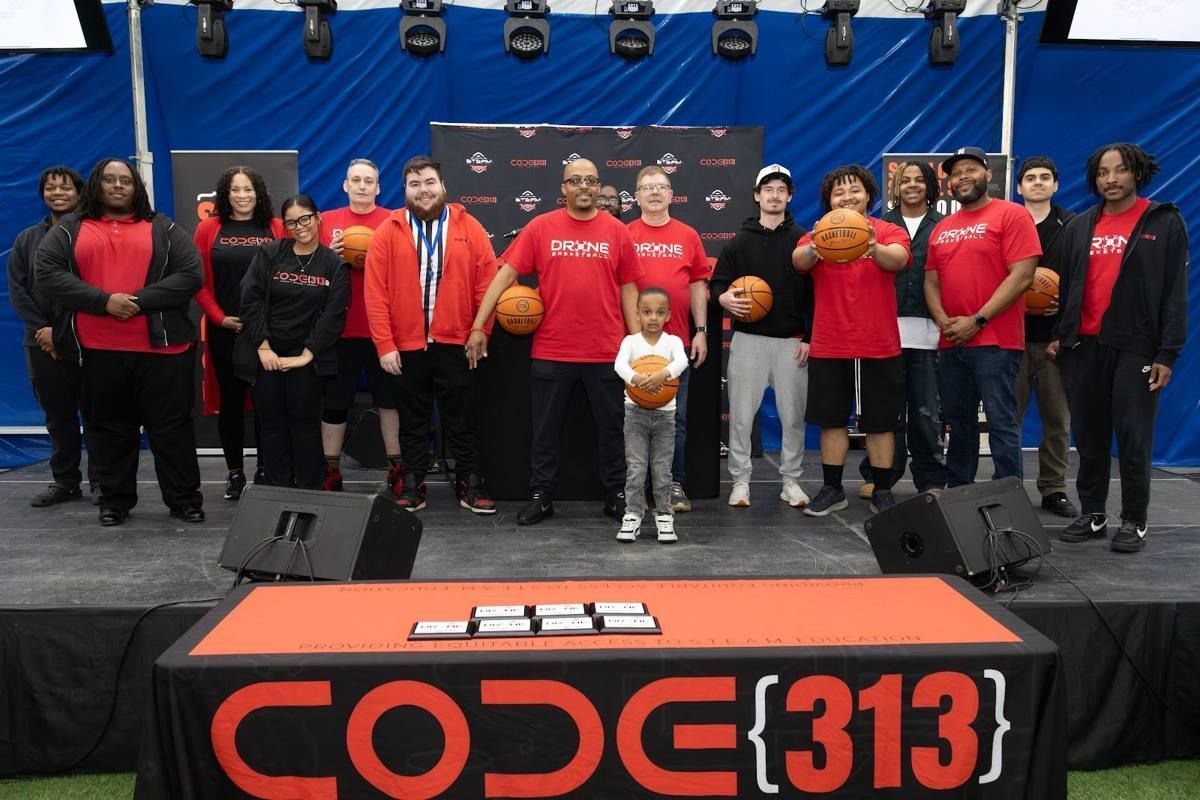 Scholars on stage at the 2025 CODE313 Drone Basketball Tournament