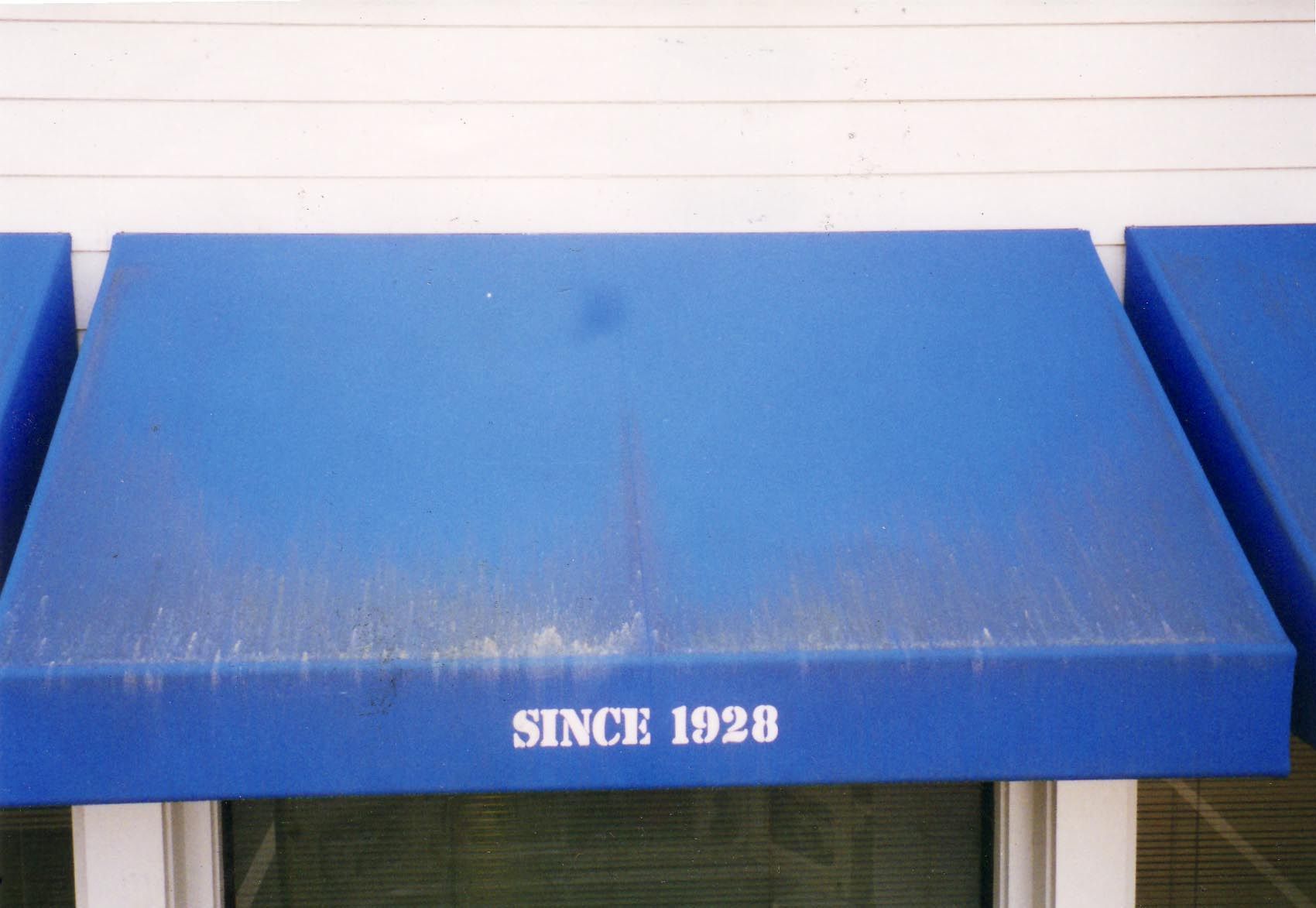 A before and after photo of a red and white striped awning