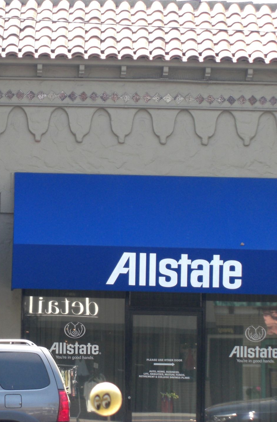 A before and after photo of a store with a blue awning.