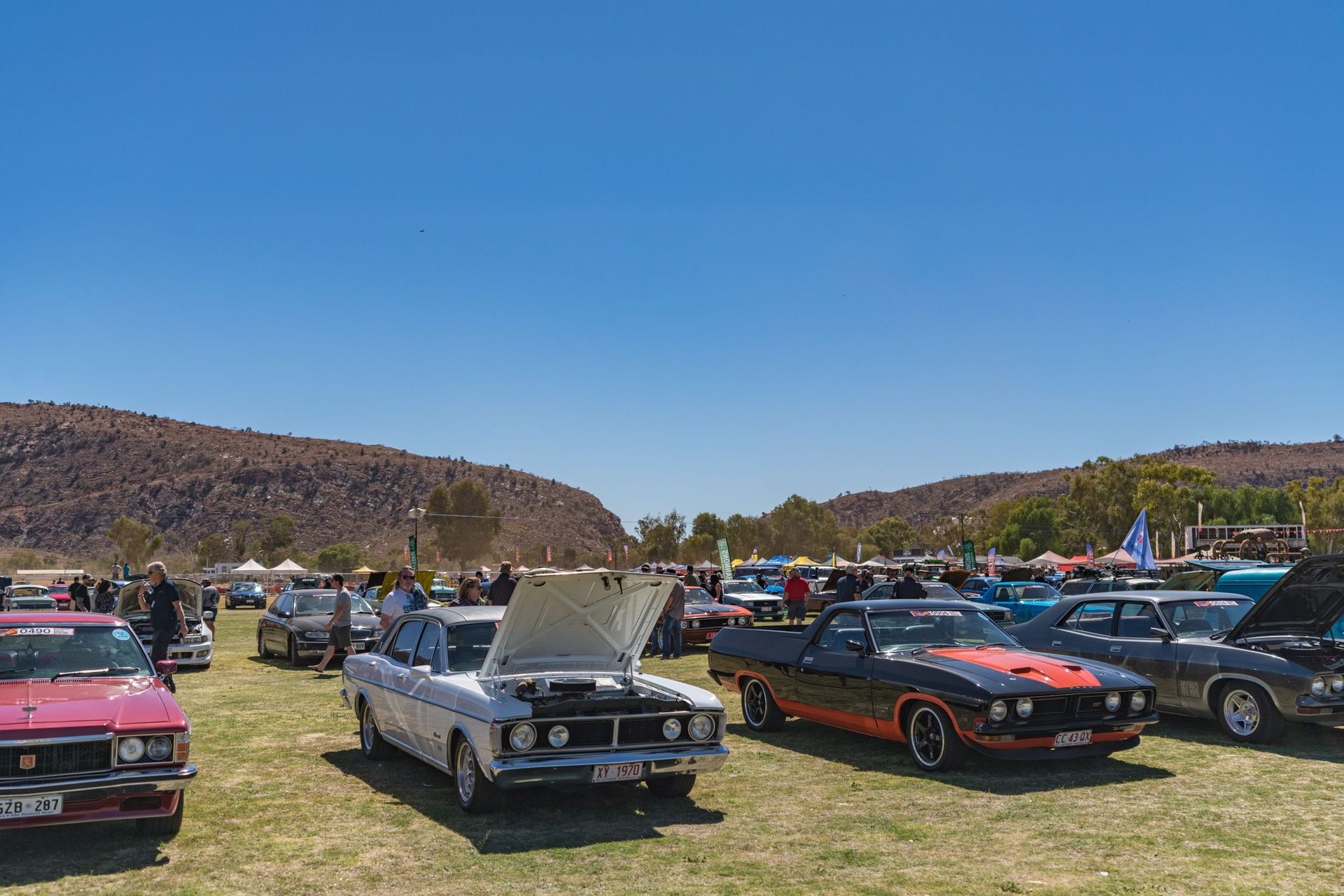 Classic Cars Parked at An Outdoor Car Show Under a Clear Blue Sky — Blatherskite Park in Ilparpa, NT