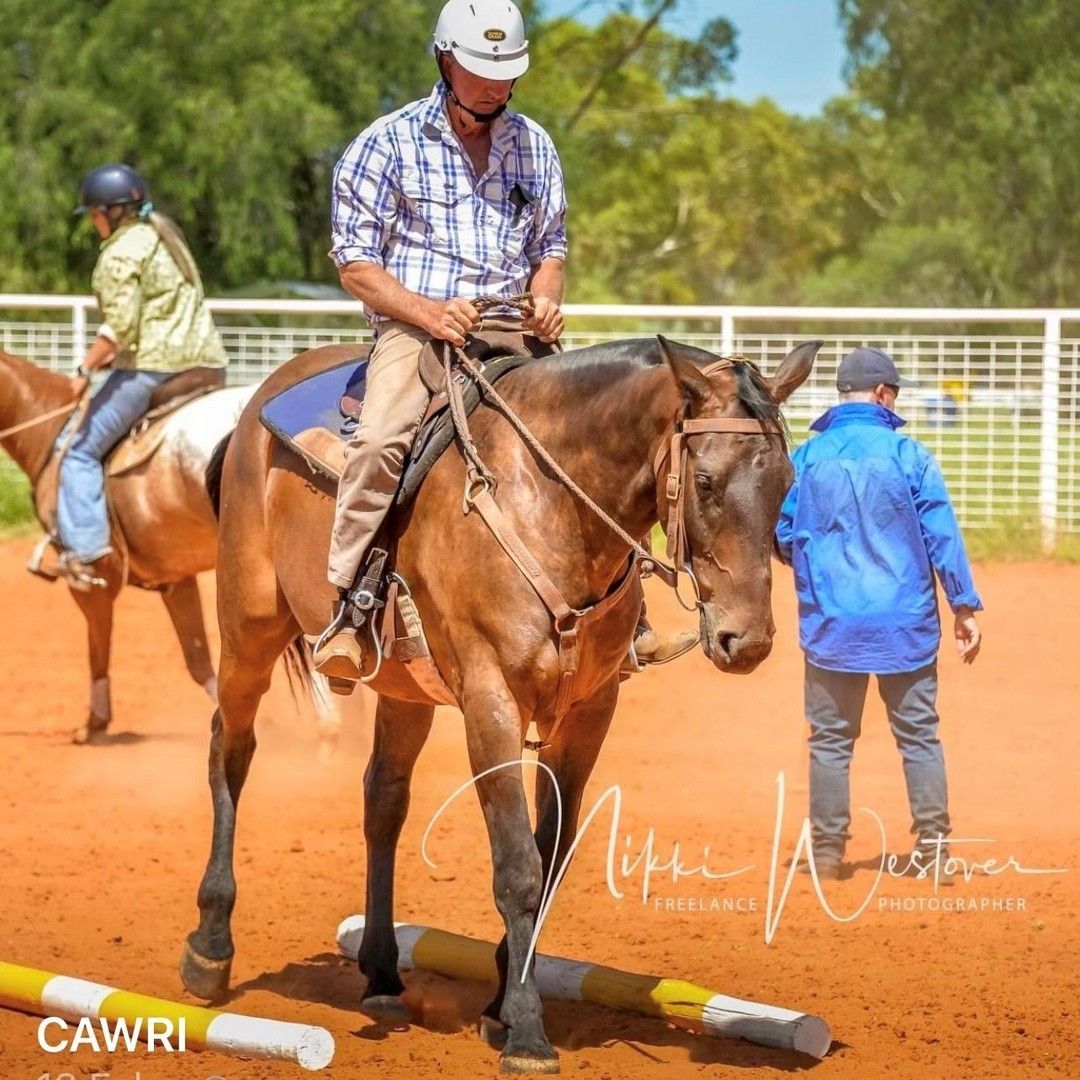 Rider on A Brown Horse in An Outdoor Arena, with Another Rider and A Person in Blue Nearby — Blatherskite Park in Ilparpa, NT