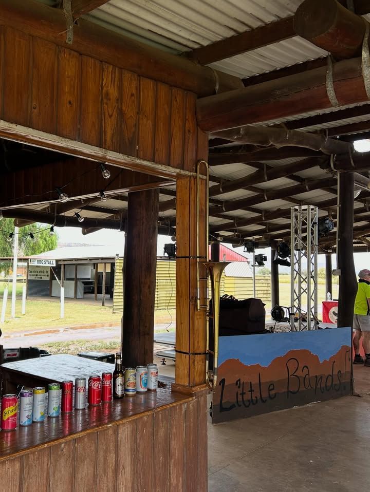 Open Air Wooden Concession Stand with A Counter of Canned Drinks and A Little Bands Sign — Blatherskite Park in Ilparpa, NT