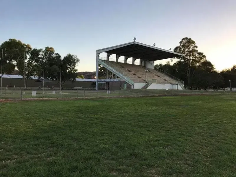 Empty Sports Field with a Covered Grandstand and Trees at Sunset — Blatherskite Park in Ilparpa, NT