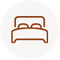 Bed icon with two pillows in a circle.