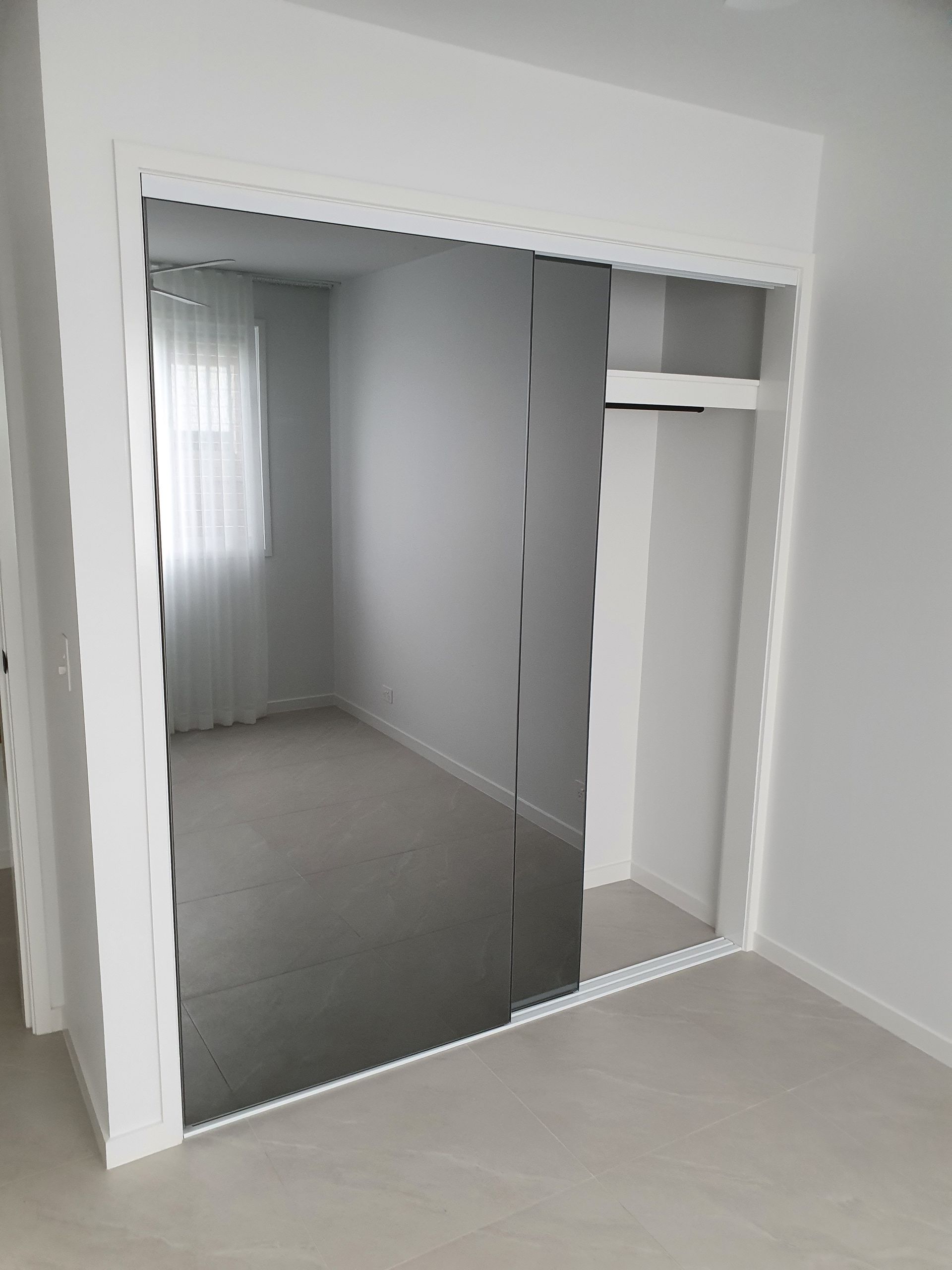 Comfortable bedroom with TV and wardrobes — Sliding Wardrobe Doors in Tamworth, NSW