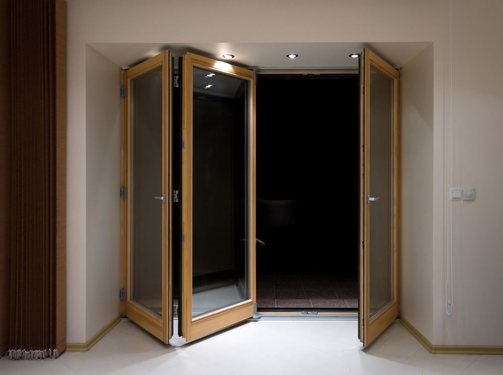 Wooden folding doors with lighting — Windows & Doors in Gunnedah, NSW