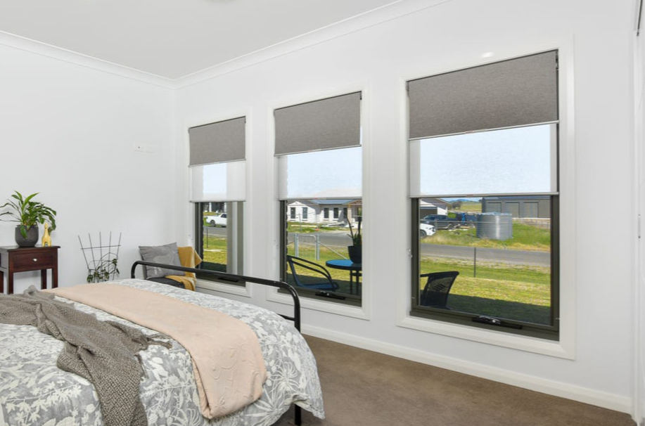 Black awning over window of shop —Sliding Windows in Tamworth, NSW