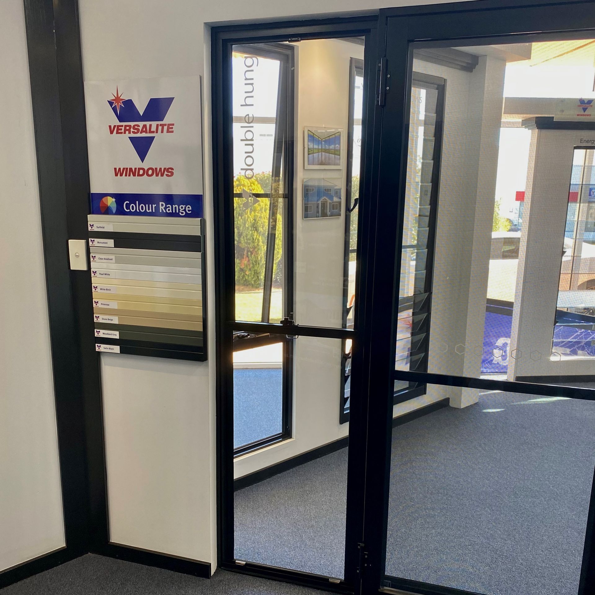 Two double hung windows with black wood frames and multiple glass panes — Double Hung Windows in Tamworth, NSW