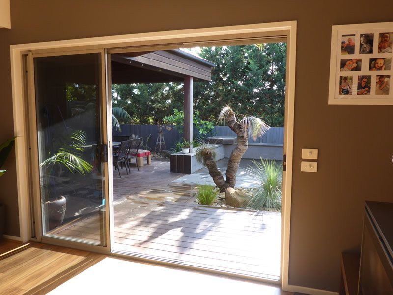Aluminum Stacker Doors fully opened — Windows & Doors in Armidale, NSW