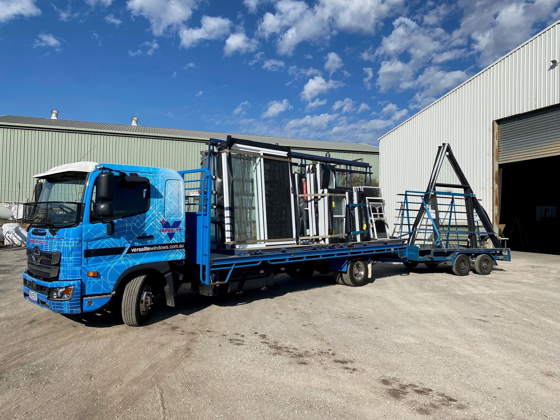 Professional worker tinting window with foil indoors — Windows & Doors in Gunnedah, NSW