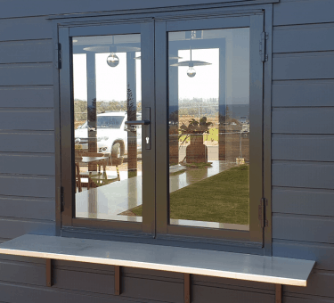 Brown frame bifold door — Bifold Doors in Tamworth, NSW