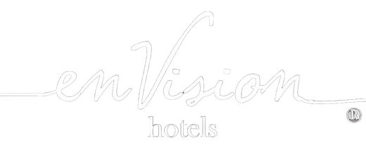 White logo reading “enVision hotel” with a small circular emblem on the right