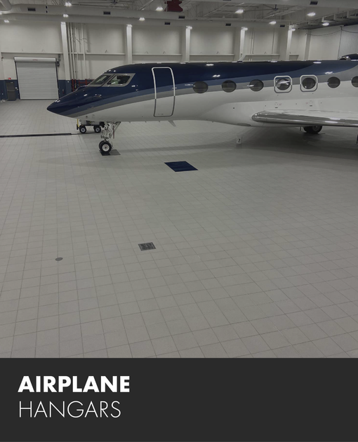 An airplane is parked in a hangar with the words airplane hangars below it