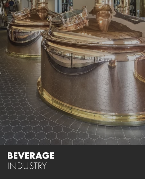 A picture of a brewery with the words beverage industry on the bottom.