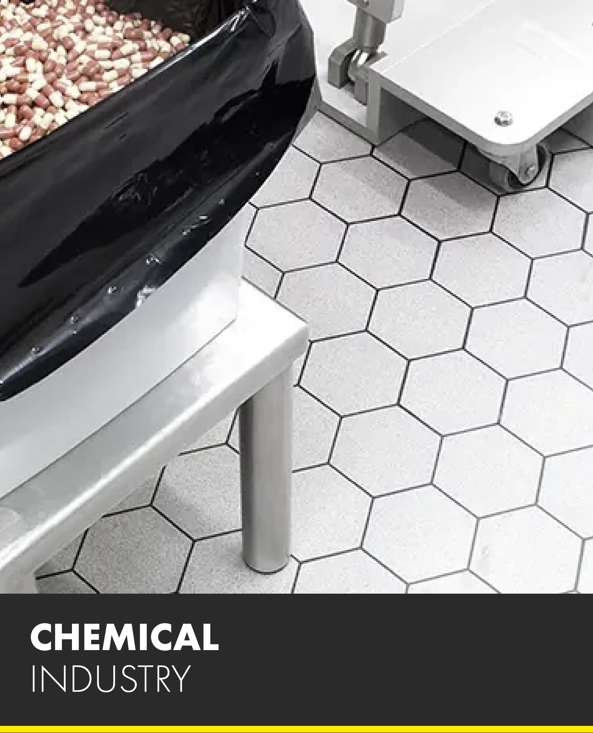 A picture of a chemical industry with a container of pills on the floor.