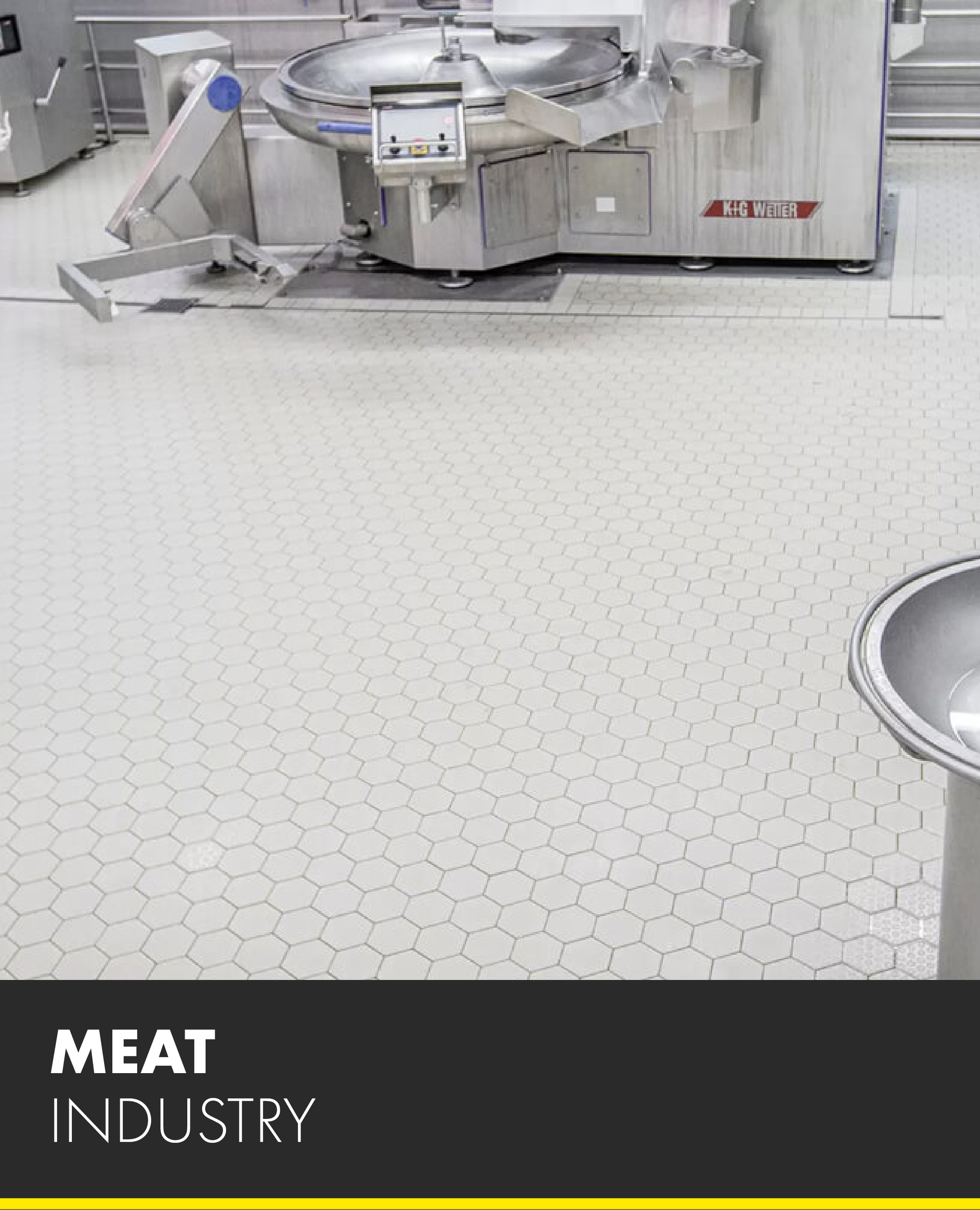 A picture of a meat industry machine on a tiled floor