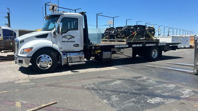 Eagle Towing Truck with White Car on the Back — Lockouts in Sacramento, CA Eagle Towing Truck with White Car on the Back — Lockouts in Sacramento, CA