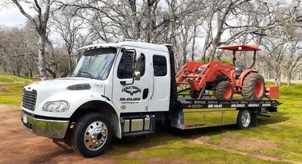 Eagle Towing Truck with White Car on the Back — Lockouts in Sacramento, CA Eagle Towing Truck with White Car on the Back — Lockouts in Sacramento, CA