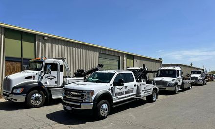 Eagle Towing Truck with White Car on the Back — Lockouts in Sacramento, CA Eagle Towing Truck with White Car on the Back — Lockouts in Sacramento, CA